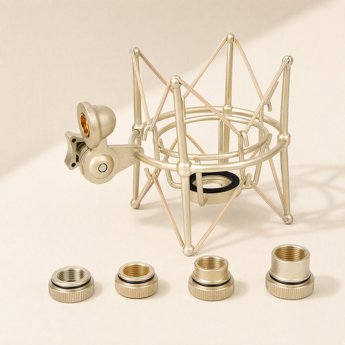 Metalhush Metal Condenser Microphone Shock Mount in champagne gold with four threaded adapters in front