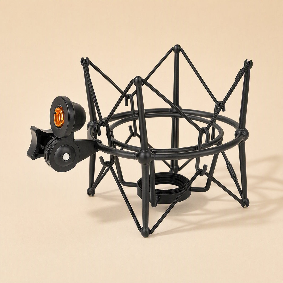 Metalhush – Black spider-style shock mount with orange-lined threaded stand mount, three-quarter view on a peach background