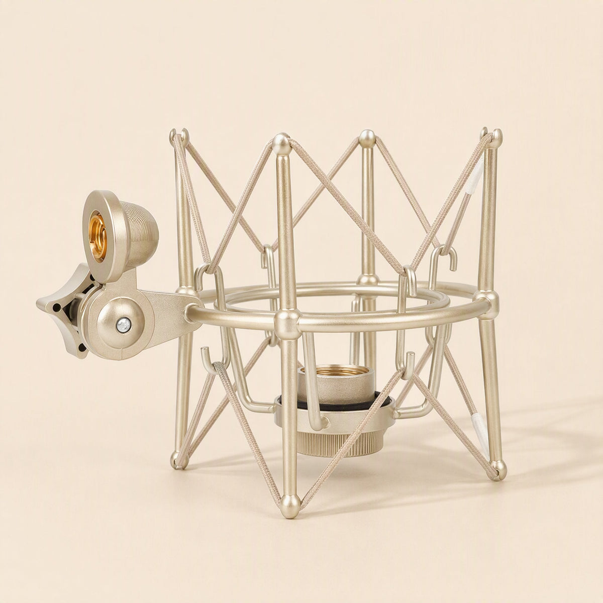 Metalhush – Champagne gold shock mount from the side, showing the rounded cradle ring, lower collar and stand clamp