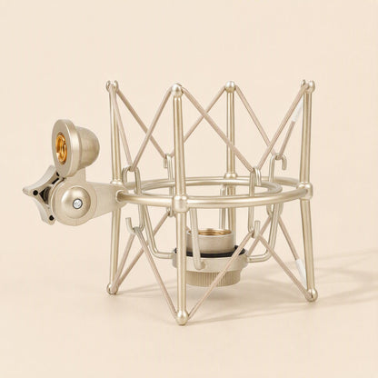 Metalhush – Champagne gold shock mount from the side, showing the rounded cradle ring, lower collar and stand clamp