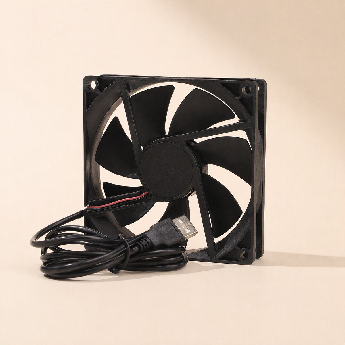 Coolbyte 5V DC Computer Cooling Fan, 9 cm, standing upright with USB cable coiled in front, angled view