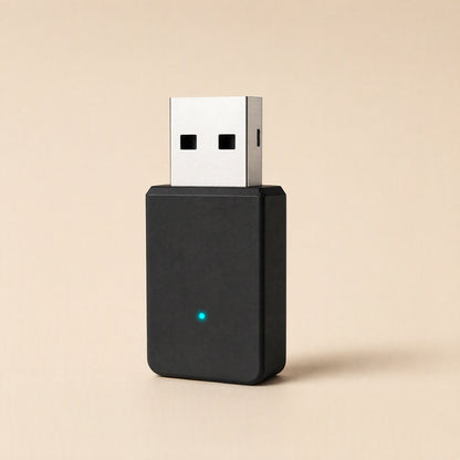 Bandbridge – Straight-on view of the black USB network card standing upright, silver connector on top, blue light lit