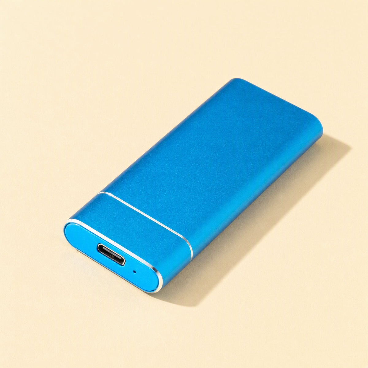 Solidrive Portable SSD – blue portable SSD at a slight angle, with USB-C port and tiny indicator light on the front end