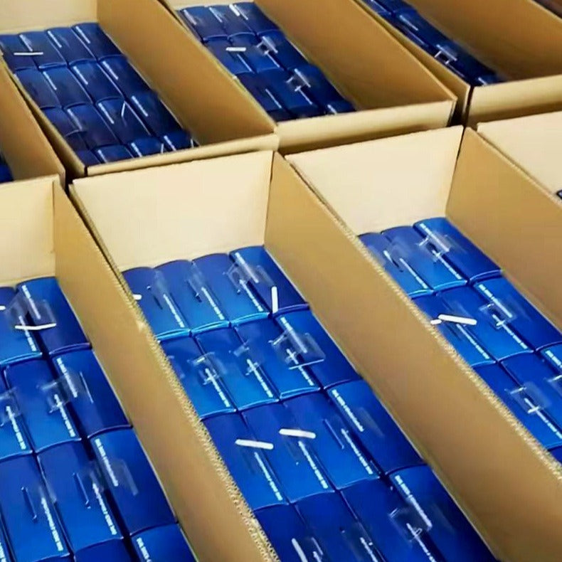 Gripvibe – Cardboard boxes packed with blue-wrapped game controllers in neat rows