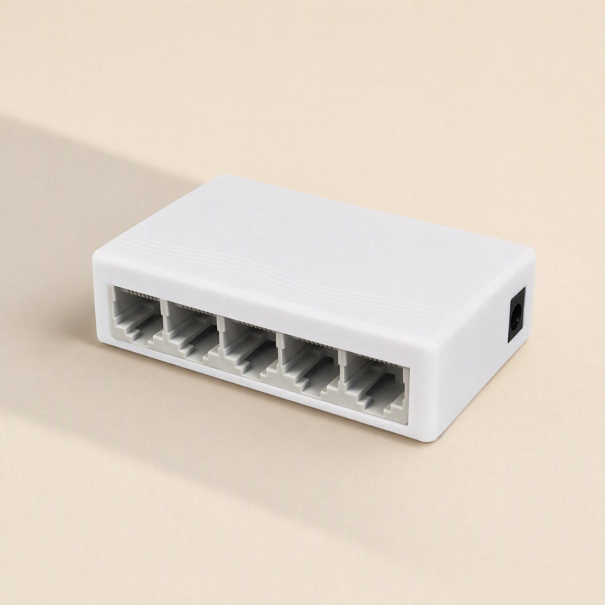 Gigaflow Gigabit Ethernet Network Switch in white, five-port model shown at an angle on a beige background