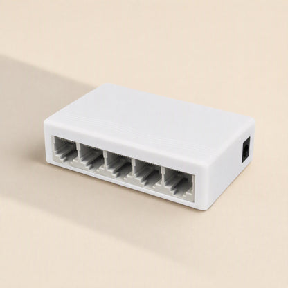 Gigaflow Gigabit Ethernet Network Switch in white, five-port model shown at an angle on a beige background