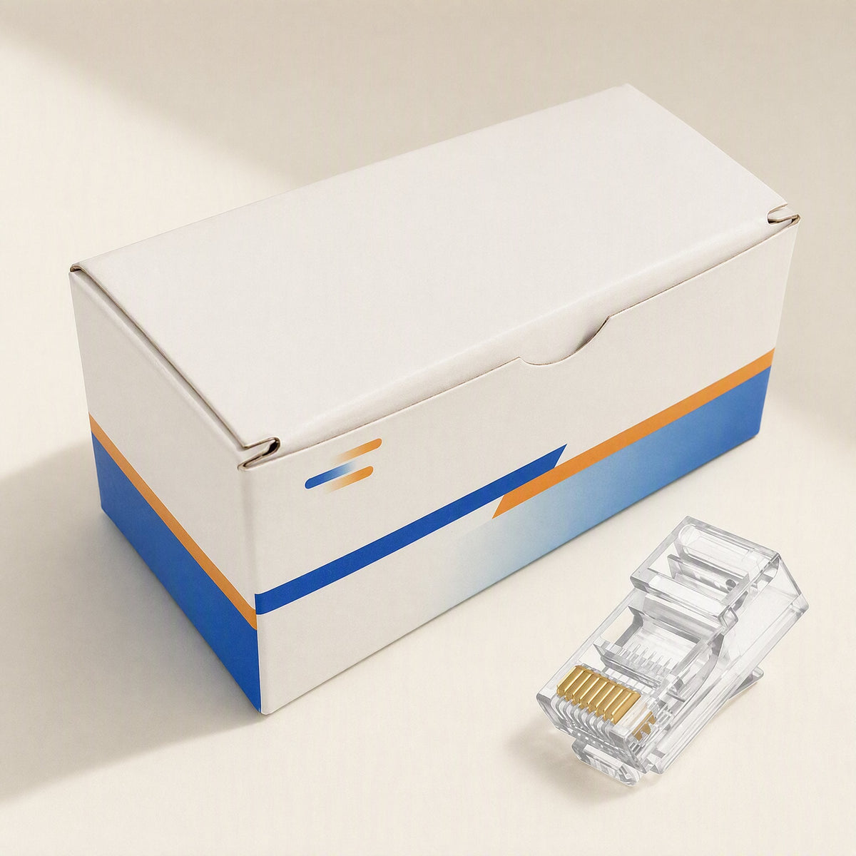 Snaplink Cat 6 RJ45 Network Cable Connector beside its white retail box with blue and orange stripes