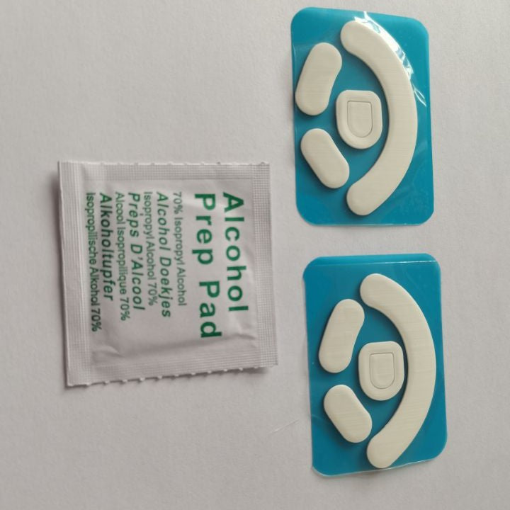 Skimfoot – Two blue-backed sheets of white mouse feet next to an alcohol prep pad packet, photographed rotated sideways