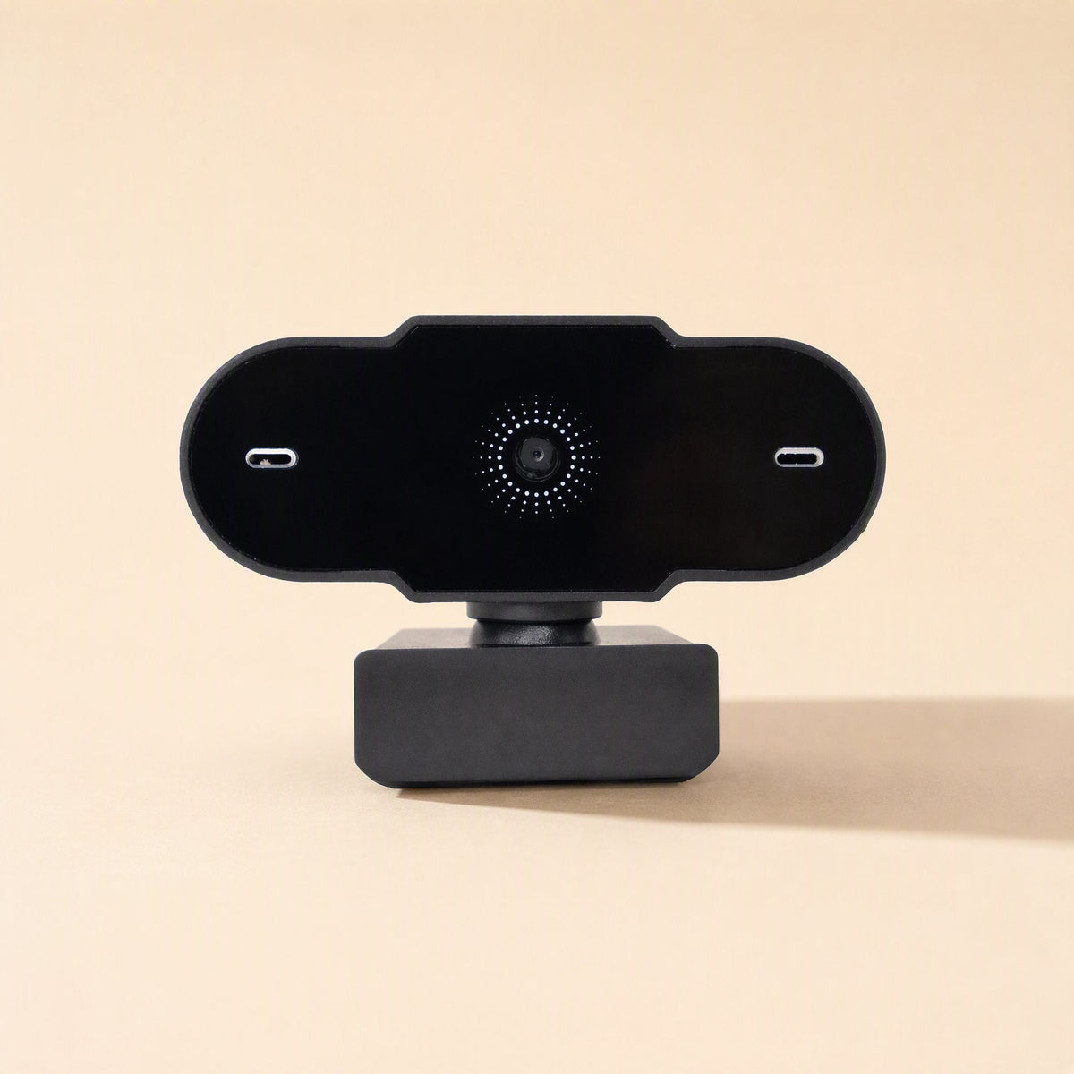 Weblens Computer USB Webcam – front view of the black webcam with the central lens ringed by dots and a slot on each side
