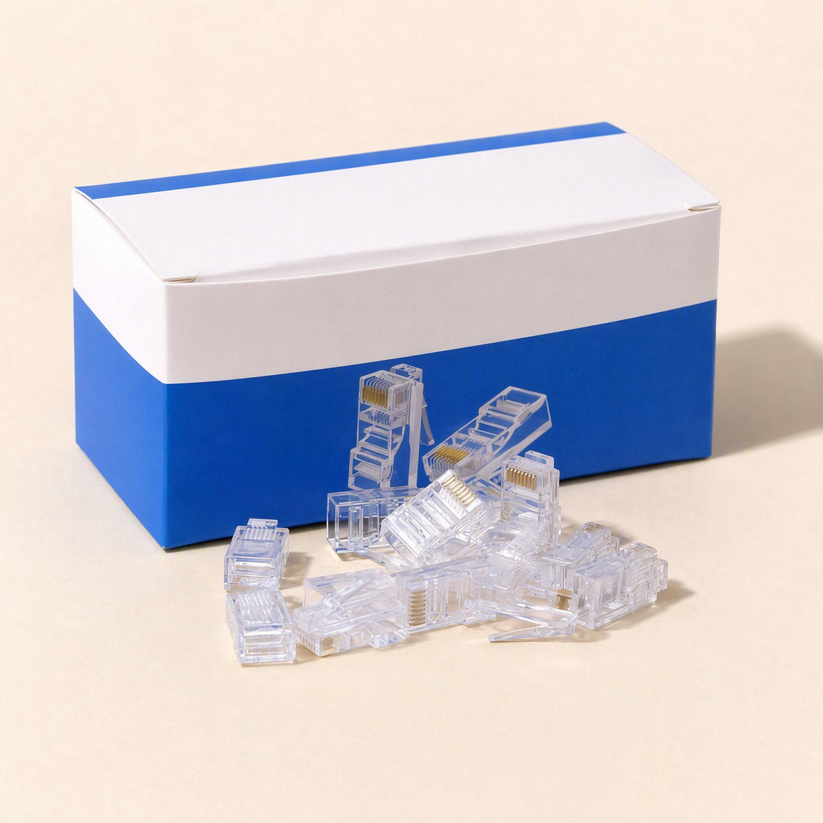 Linksnap RJ45 Network Cable Plug – pile of clear RJ45 plugs in front of a blue and white box, with gold contacts visible