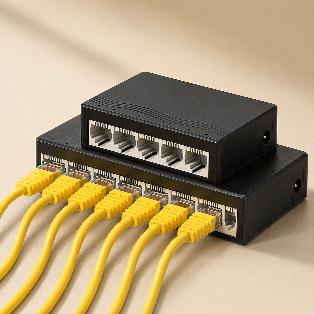 Fiveflow 5-Port Ethernet Network Switch stacked on a larger switch with yellow Ethernet cables plugged in