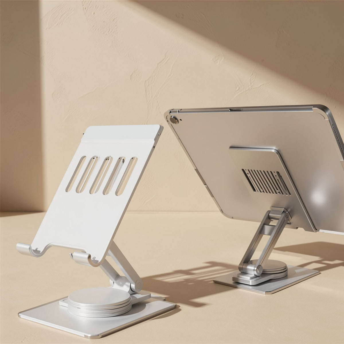 Turnstand Aluminum Alloy 360° Rotating Tablet and Phone Stand holding two tablets, one showing its back vents