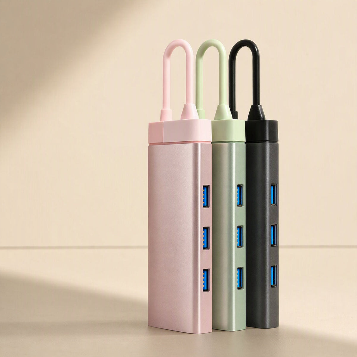 Dockcraft USB-C Multiport Docking Station in pink, sage green and black, standing with three blue USB ports