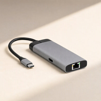 Dockcraft – Top-angle view of the gray docking station with Ethernet port and USB-C port on a cream surface