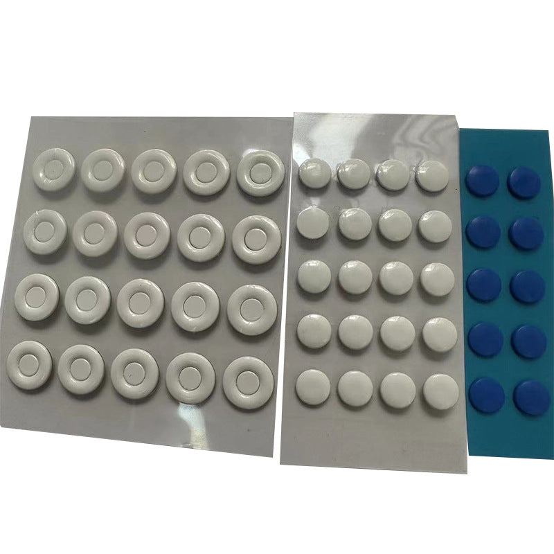 Teflide – Three sheets of mouse foot stickers: white rings, small white dots and blue dots, on a plain white background