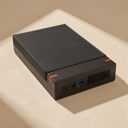 Drivestow – Box lying flat, showing a power button, DC jack, two blue USB ports and a side vent on the end panel