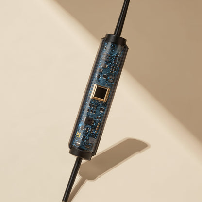 Cordtone – Close-up of the inline microphone module showing a blue circuit board and gold-trimmed chip through clear casing