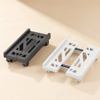 Towerstack – Black and white adjustable tower racks with cutout patterns, shown from above on a beige surface