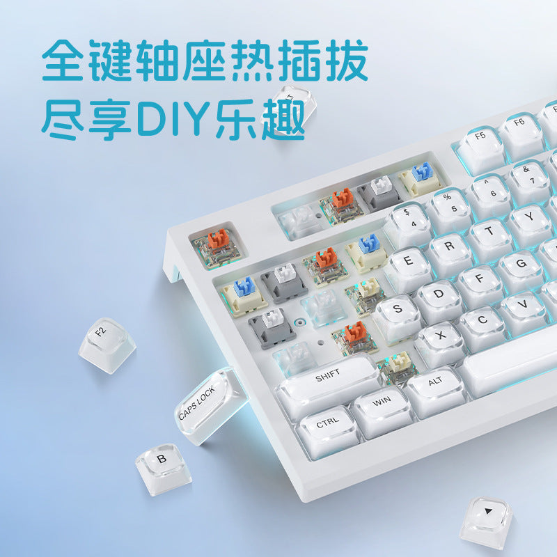 Keystream – Keyboard with several keycaps and switches removed, showing colorful hot-swappable switch sockets