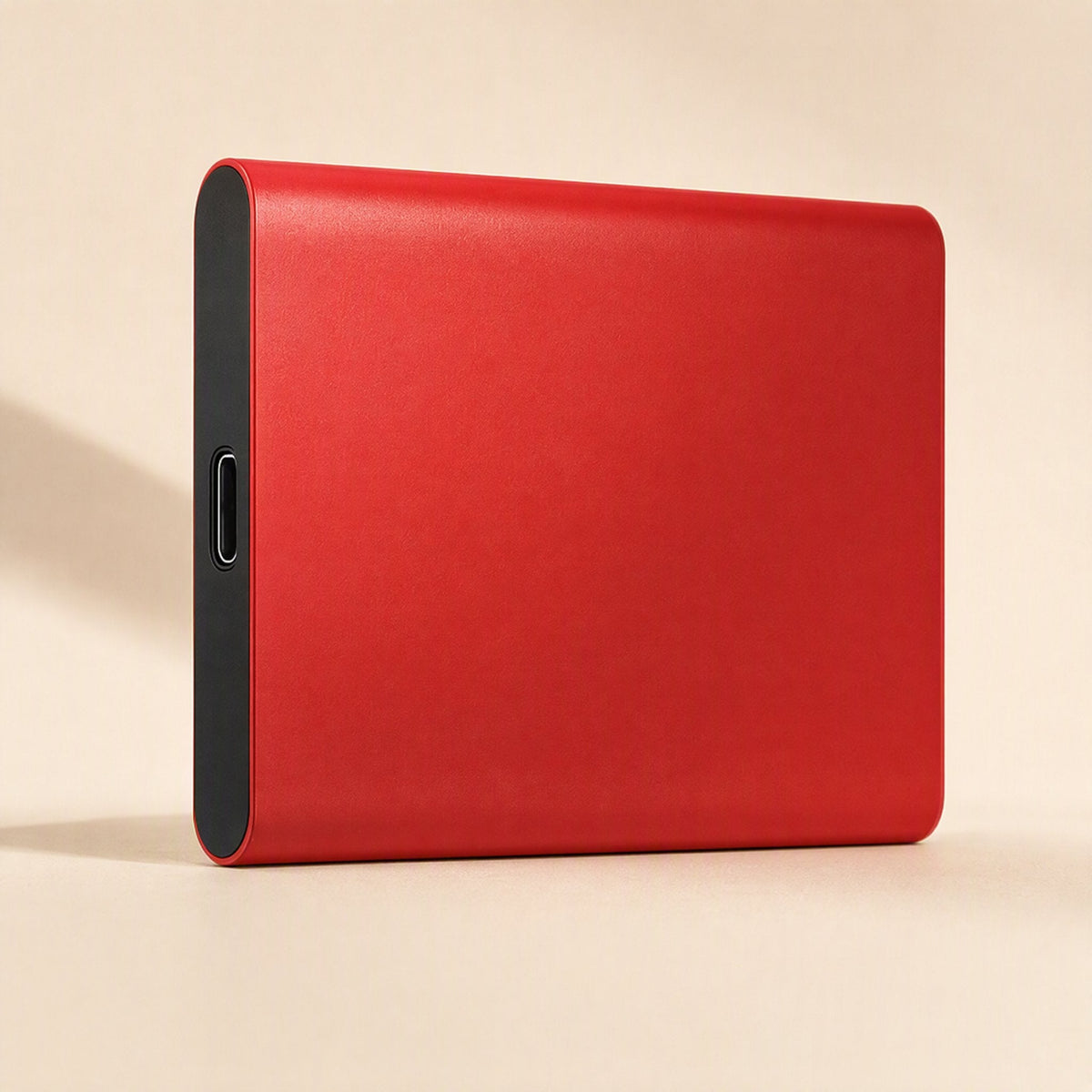 Slimstore – Red slim metal drive seen from the side, with a black end cap and centered USB-C port