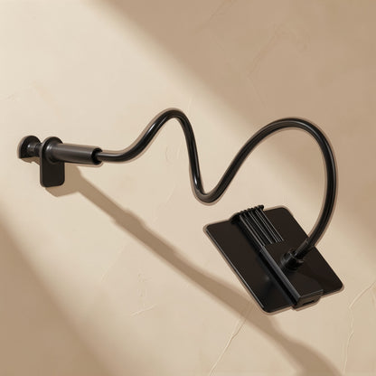 Tiltprop – Black flexible arm with a clamp mounted on a wall, holding a flat black tablet cradle