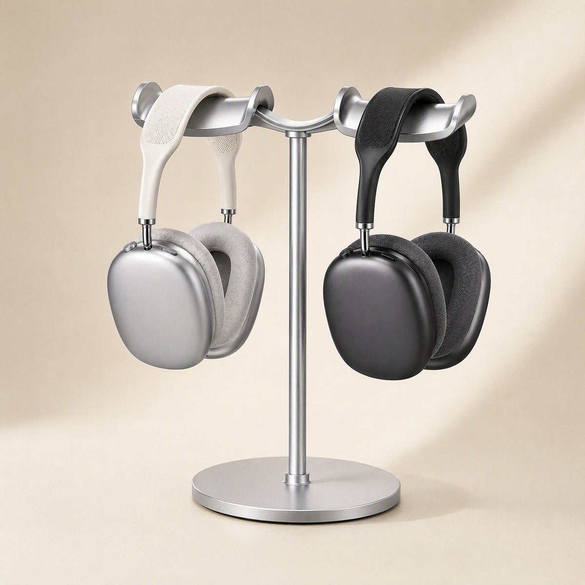 Twinrack Double Headphone Storage Rack in silver holding a cream and a black pair of over-ear headphones
