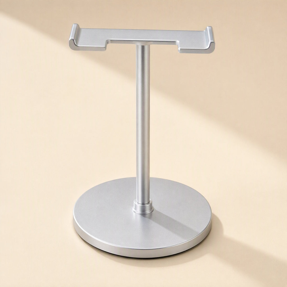 Twinrack Double Headphone Storage Rack – silver T-shaped headphone stand with round base, front view on a beige background