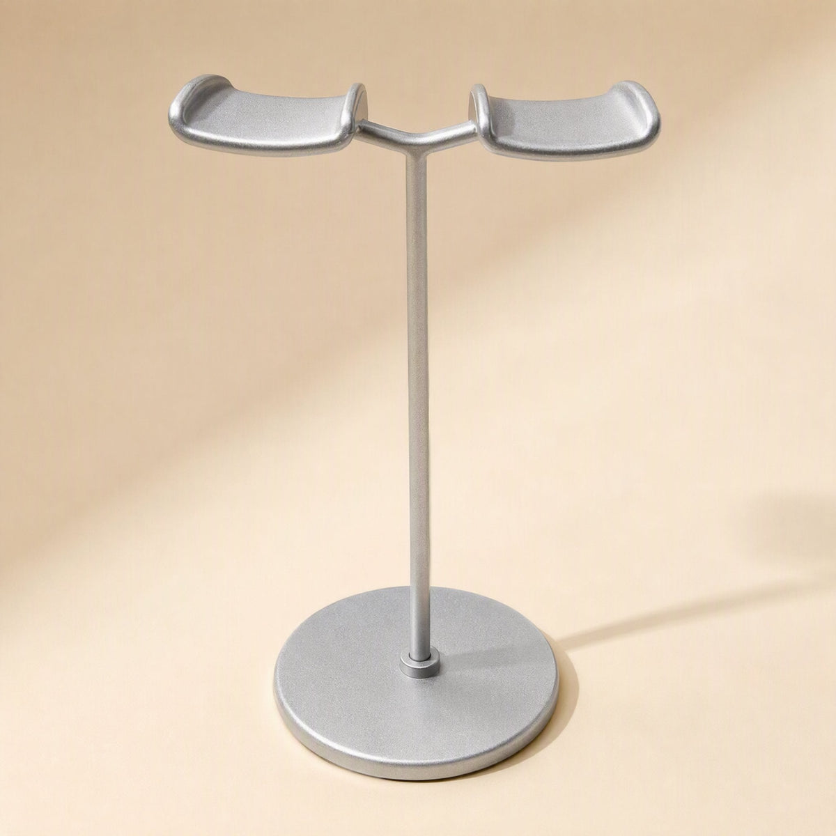 Twinrack – Front view of silver double headphone stand with two upturned cradle arms on a slim pole