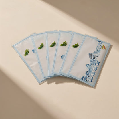 Chilldots – Six white sachets with blue borders and green mint leaf prints fanned out on a beige surface