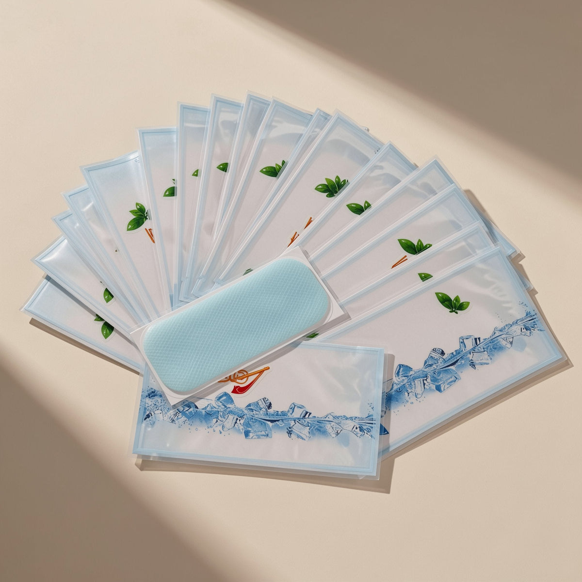 Chilldots Hydrogel Cooling Stickers – fan of printed sachets with ice cube artwork, one opened sheet in pale blue laid on top