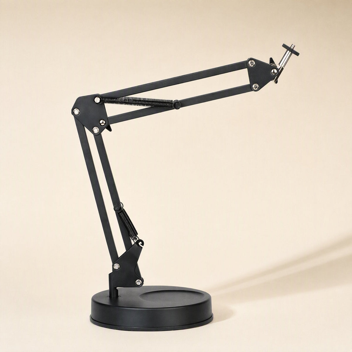 Phonebrace – Black folding arm bracket with round base and spring-loaded jointed arm extended to the right