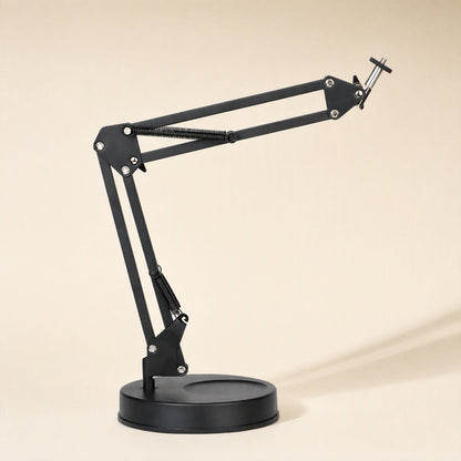 Phonebrace – Black folding arm bracket with round base and spring-loaded jointed arm extended to the right