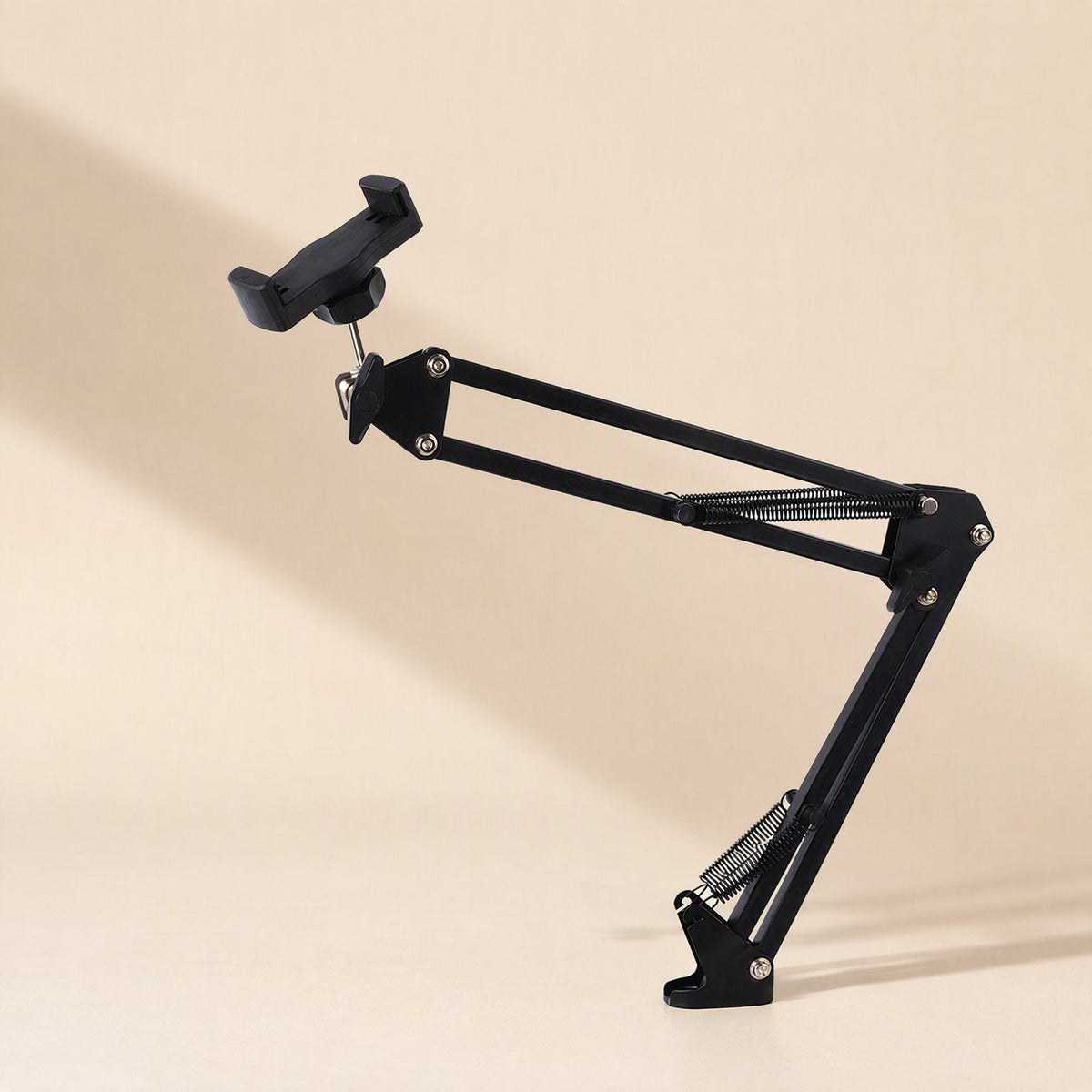 Phonebrace – Side view of black bracket arm with phone clamp, springs and flat foot at the base