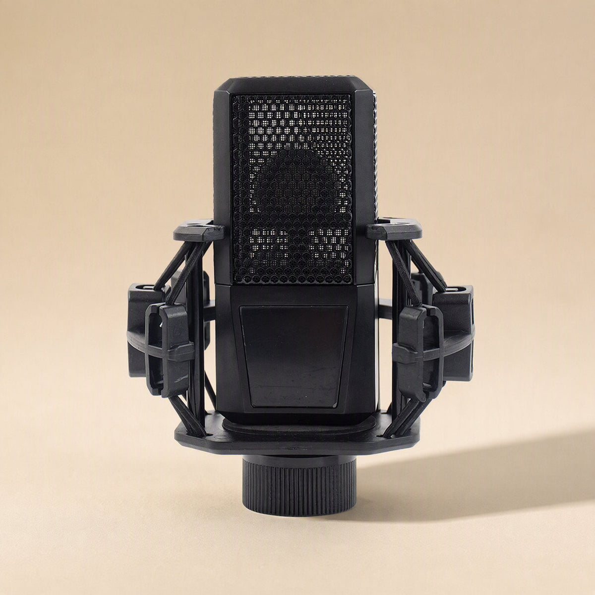Tonecapture Condenser Microphone – front view of black mesh-grille condenser microphone held in a black shock mount
