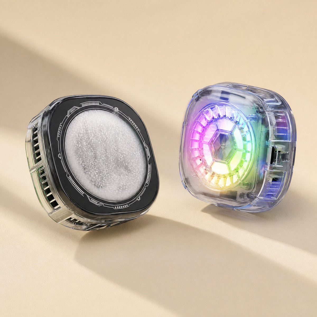 Icecore – Two clear-bodied square coolers: one showing the frosted cooling plate, the other with a rainbow-lit fan
