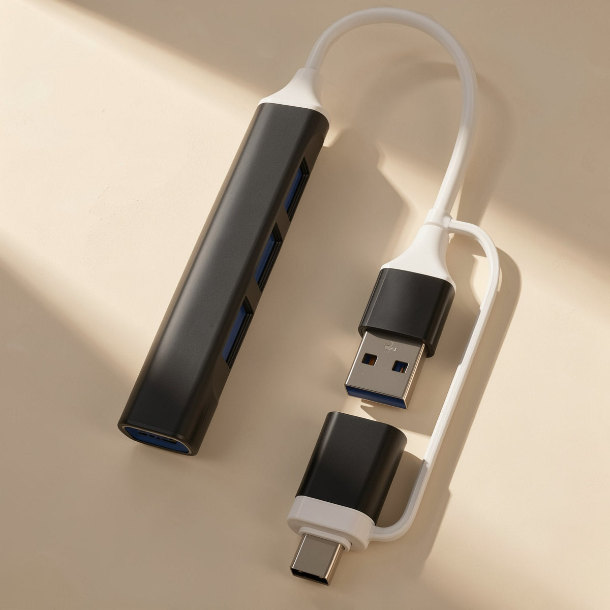 Docklink – Black version of the hub with white cable, USB-A plug and detachable USB-C adapter on a beige surface