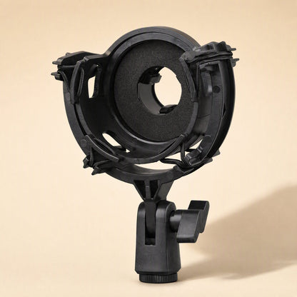 Shockgrip – Front view of a round black mount with a foam-lined center opening and a clamp base below