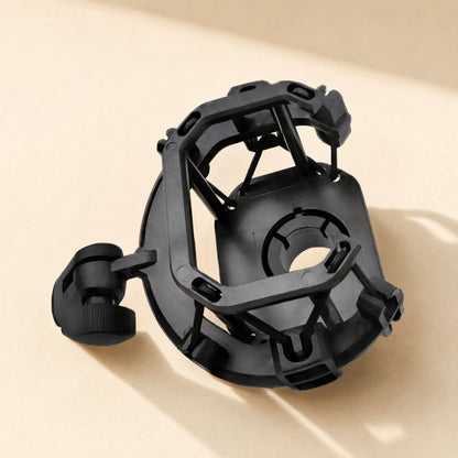 Shockgrip – Top-down angled view of a black rectangular suspension mount with side thumbscrew knob