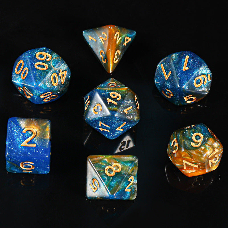 Facetforge Acrylic Multi-Sided Dice set in blue and amber with gold numerals on a black surface