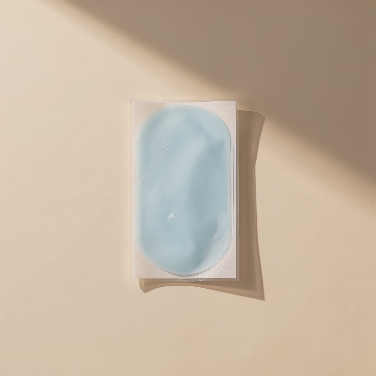 Chillchip Mobile Phone Cooling Stickers – pale blue hydrogel cooling sticker on clear backing film, shown flat in soft light