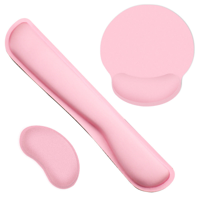 Palmcushion – Pink mouse pad, small wrist cushion and long keyboard wrist rest arranged on a white background
