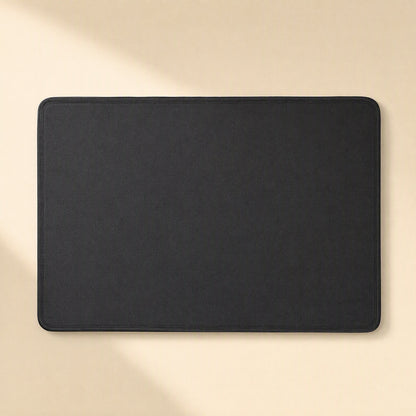Coverloom Monitor Dust Cover – black dust cover laid flat, top-down view showing rounded corners and stitched edge