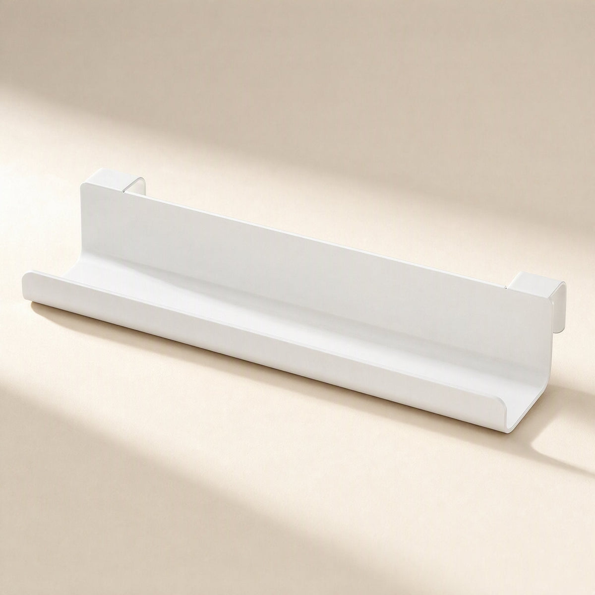 Wireledge – Front angled view of a white open-top under-table cable rack with mounting brackets on both ends