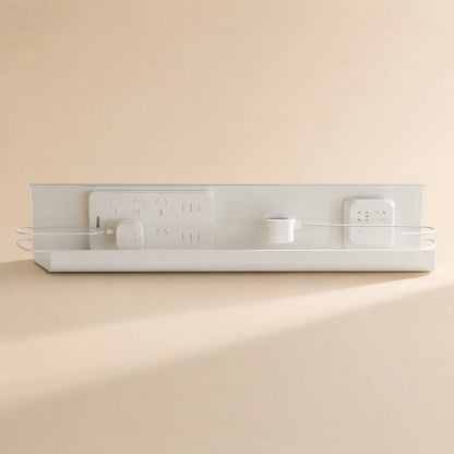 Wireledge – Front view of the white rack with a power strip and adapters mounted, cords looped through side wires