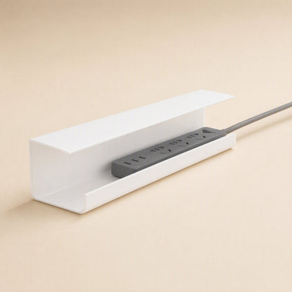 Wireledge – White covered cable box with a gray power strip resting inside and its cord trailing out