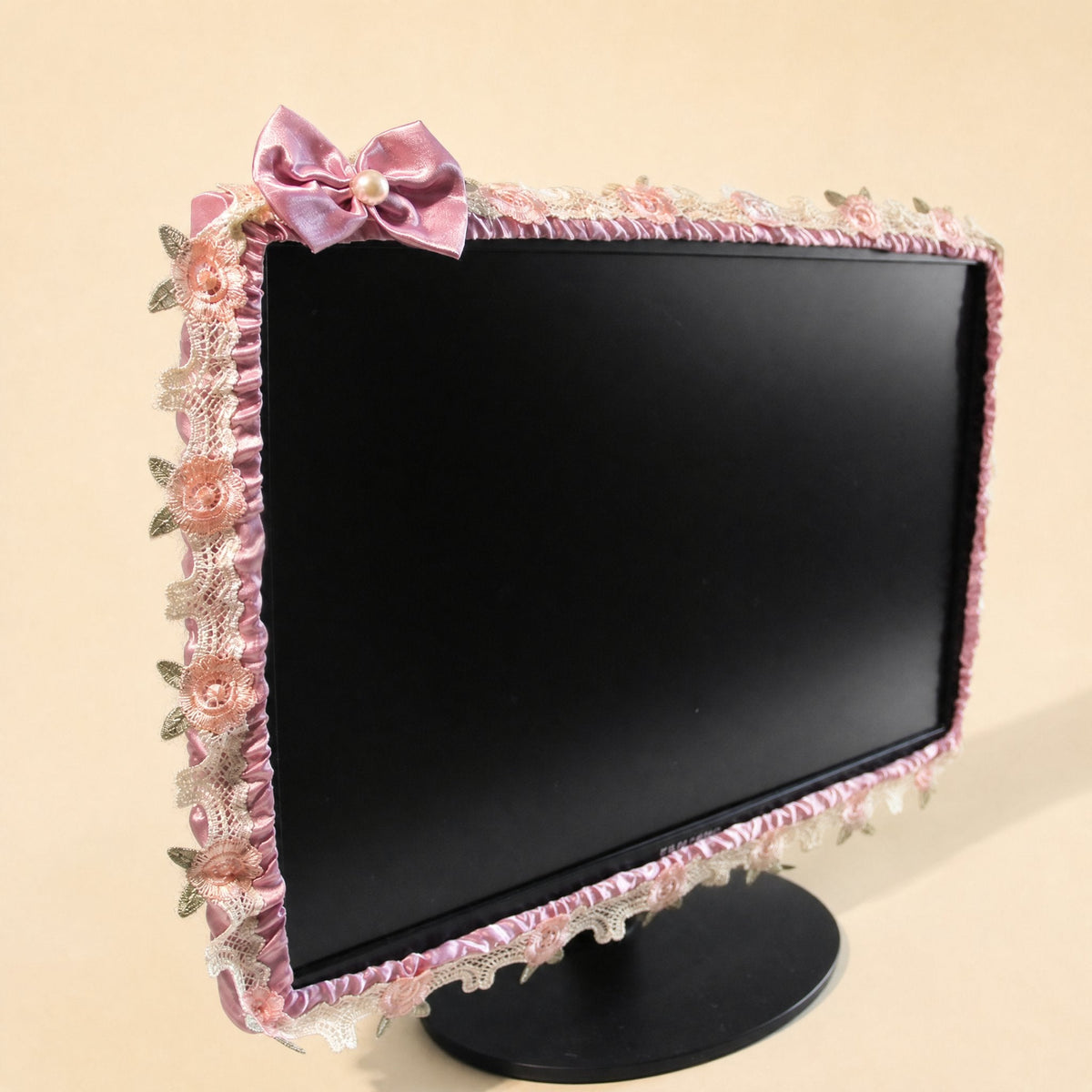 Silkdrape Computer Cover in mauve satin with ruffled edges, pink lace roses and a pearl-centered bow on a monitor
