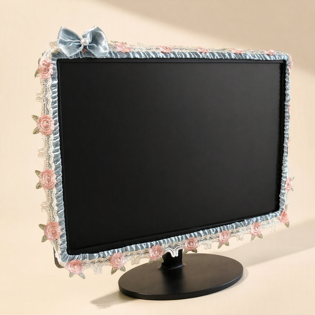 Silkdrape – Light blue satin monitor cover with pink lace roses, ruffled edging and a blue bow at the top left corner