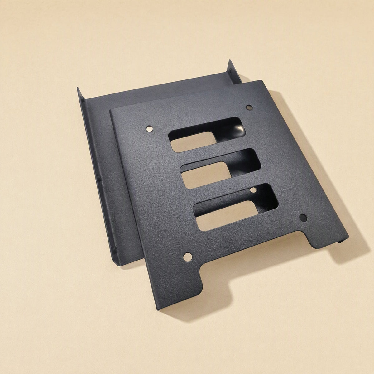Diskfit 2.5-inch to 3.5-inch hard disk bracket in black frosted metal, shown from above with a second bracket behind