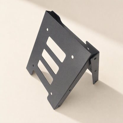 Diskfit – Bracket standing upright on its side, showing slotted cutouts and the mounting flange with screw holes