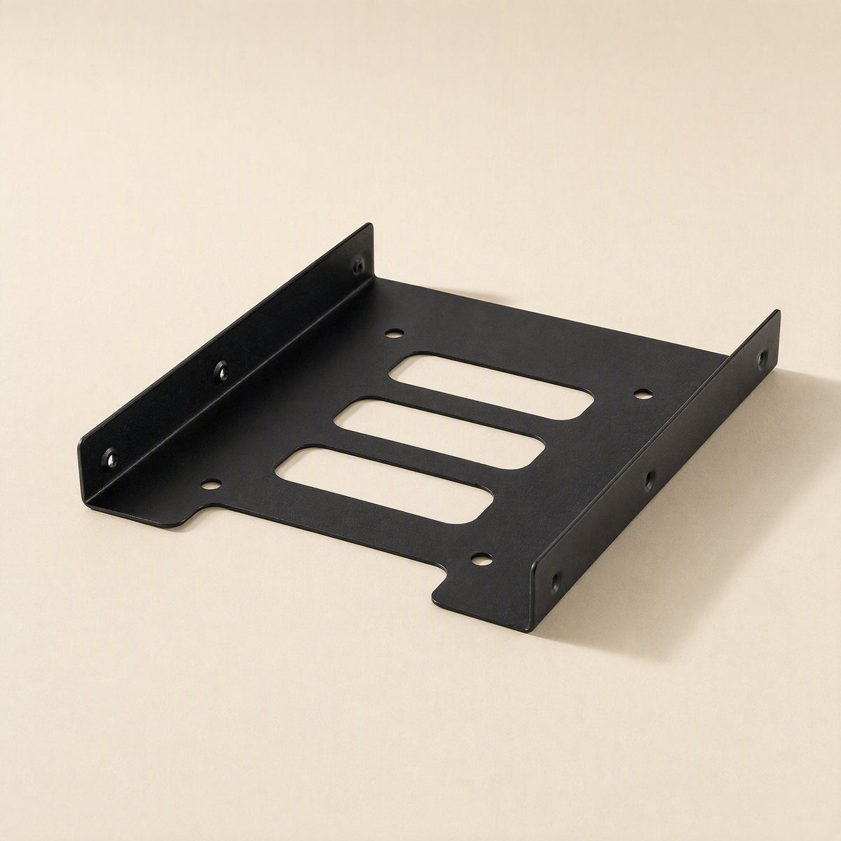 Diskfit – Side-angle view of the black bracket showing raised side flanges, screw holes and three slots